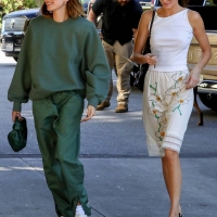 Hailey Bieber with Kendall Jenner showing her braless boobs and pokies in a white top at the Beverly Grill in Beverly Hills 22.jpg
