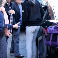Zendaya taking a selfie with a fan while in grey leggings in New York City 06.jpg