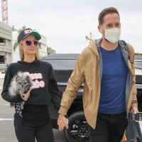 Paris Hilton in leggings with Carter Reum at the airport 03.jpg