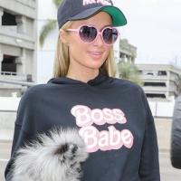 Paris Hilton in leggings with Carter Reum at the airport 06.jpg