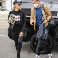Paris Hilton in leggings with Carter Reum at the airport 11.jpg