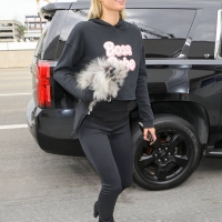 Paris Hilton in leggings with Carter Reum at the airport 15.jpg