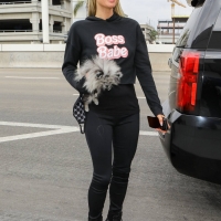 Paris Hilton in leggings with Carter Reum at the airport 17.jpg