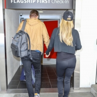 Paris Hilton in leggings with Carter Reum at the airport 16.jpg