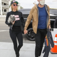 Paris Hilton in leggings with Carter Reum at the airport 19.jpg