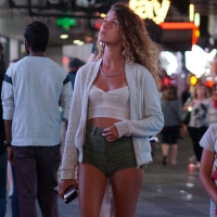 Cheeky babe in green shorts
