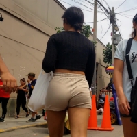 Latina in tan shorts
