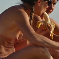 Topless candid babe with nice tits eating a banana at the beach beach-banana_4k.mp4-2022-12-29-15h58m17s539.jpg